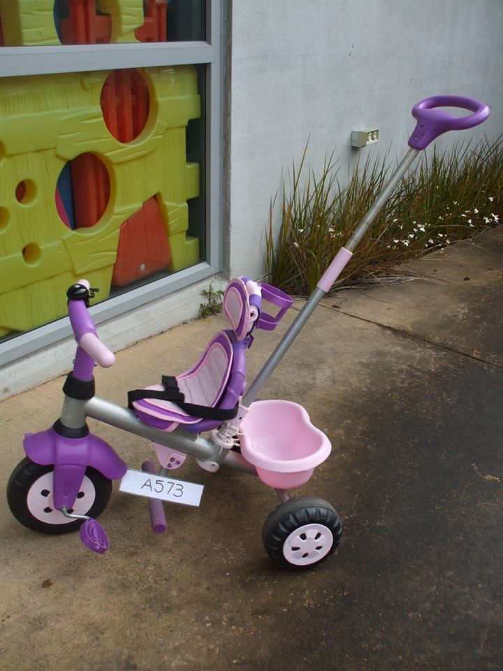 pink trike with handle